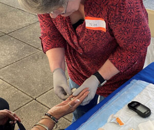 NIDA Clinical Research Nurse, Susan Sawyer performs health assessments in the field.