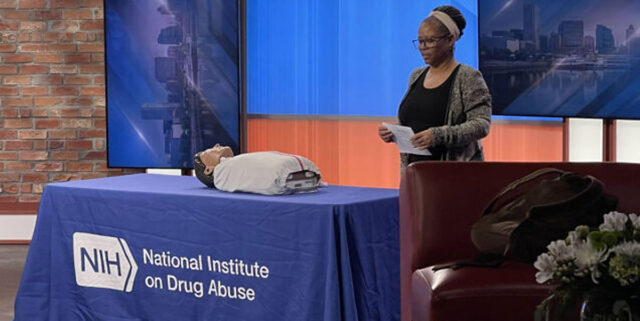 NIDA PA Kathy Lightfoot on set at Fox 45 Baltimore demostrating how to administer Naloxone.